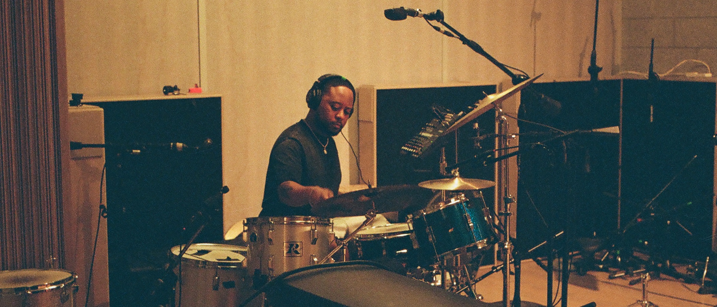 Supah Mario playing drums photographed by Ellen Lee